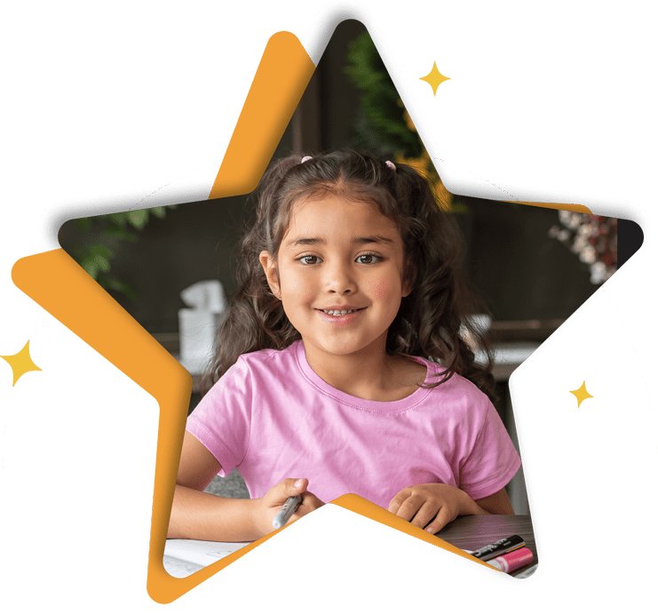 girl working on worksheet and smiling star